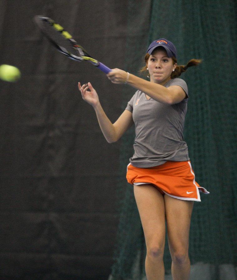Illinois’ Madie Baillon hits the ball back during the Midwest Tennis Regionals at Atkins Tennis Center on Oct. 17.