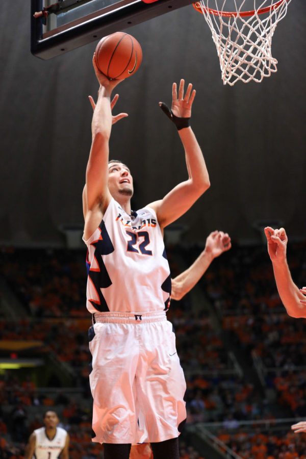 Illinois Maverick Morgan attempts a close-range shot during the game against American at State Farm Center on Dec. 6. Morgan scored eight points in 11 minutes, plus four rebounds