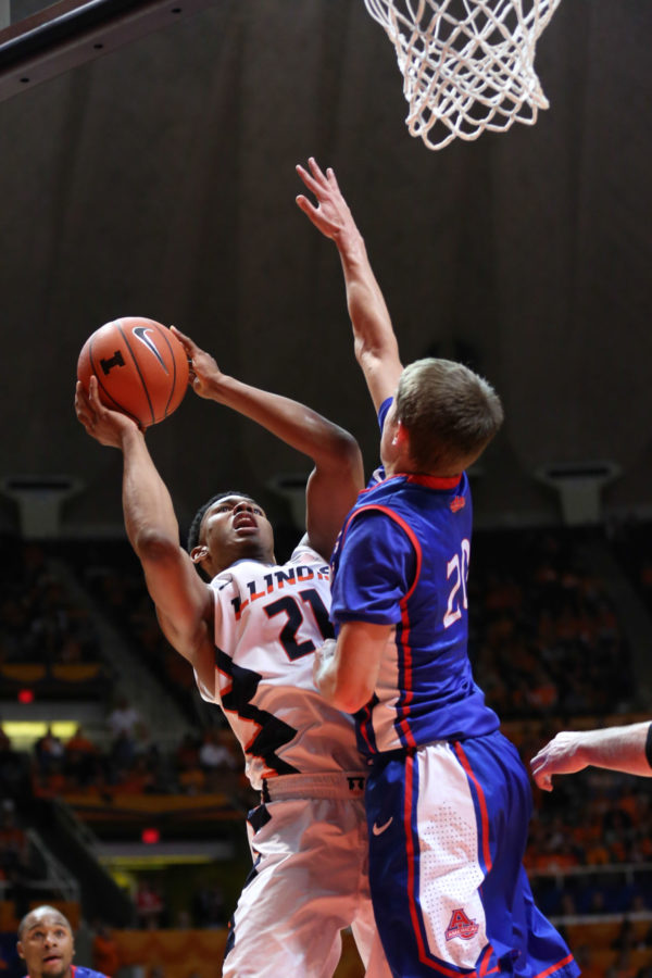 Illinois Malcolm Hill (21) attempts a contested shot during the game against American at State Farm Center, on Dec.6, 2014. The Illini won 70-55.