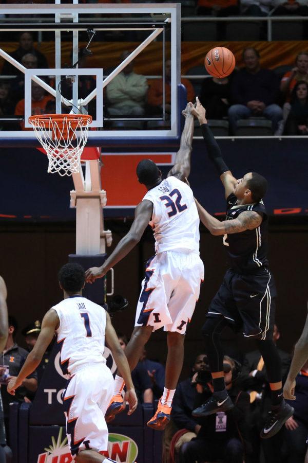 Illinois Nnanna Egwu rises with Purdues Vince Edwards for a block during the game against Purdue at State Farm Center on Wednesday. The Illini won 66-57 and Egwu set the career block record at Illinois. 