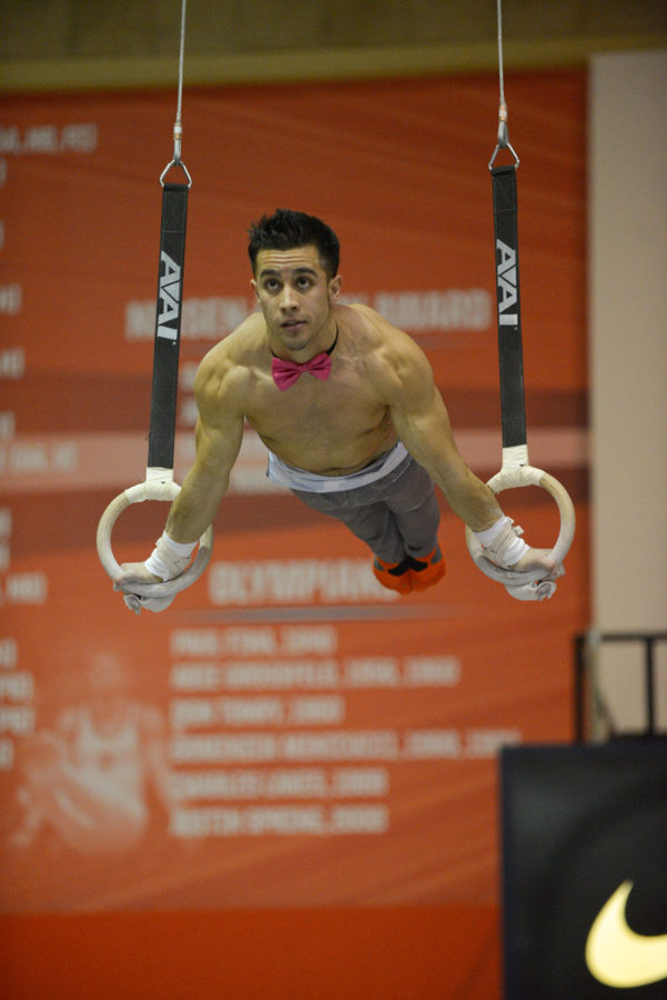 C.J. Maestas performs the rings routine at the Orange and Blue Exhibition at Huff Hall on Dec. 7.
