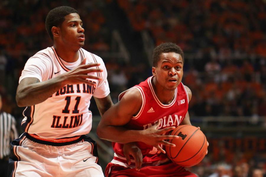 Illinois Aaron Cosby (11) attempts to stop Indianas Kevin (Yogi) Ferrell from attempting a layup during the game against Indiana at State Farm Center on Jan. 18, 2015. The Illini lost 80-74.
