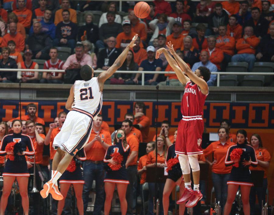 Illinois Malcolm Hill attempts to defend Indianas James Blackmon, Jr., during the game against Indiana at State Farm Center on Sunday. The Illini lost 80-74.