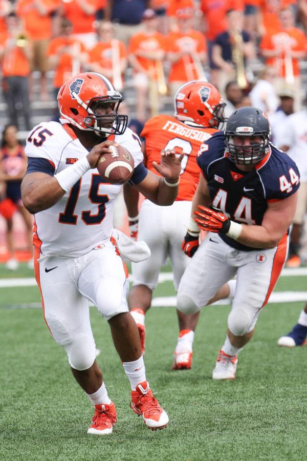 Illinois+Aaron+Bailey+%2815%29+looks+for+an+open+pass+during+the+annual+Orange+and+Blue+Spring+Game+at+Memorial+Stadium%2C+on+Saturday%2C+April+13%2C+2014.+The+Blue+team+won+38-7.