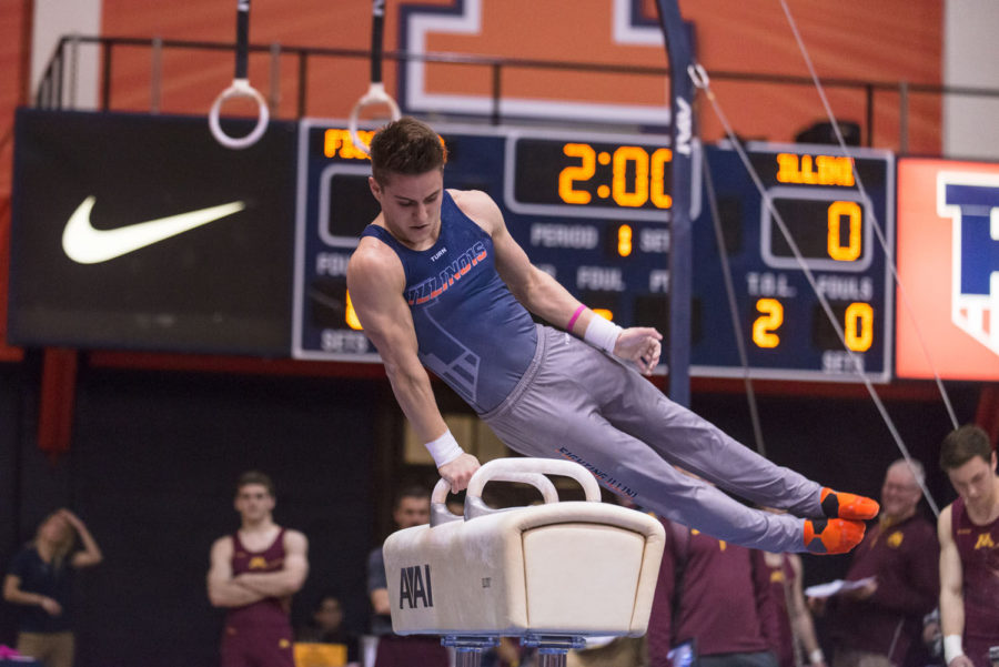 Illinois Bobby Baker performs a routine on the pommel horse during the match against Minnesota at Huff Hall on Saturday.