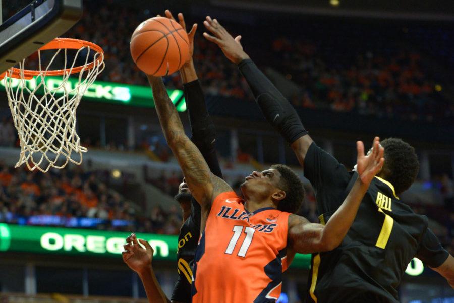 Illinois’ Aaron Cosby (11) shoots the ball during the game against Oregon at United Center in Chicago, Illinois on Saturday, Dec. 13, 2014. It was announced Friday that Cosby is no longer on the team.