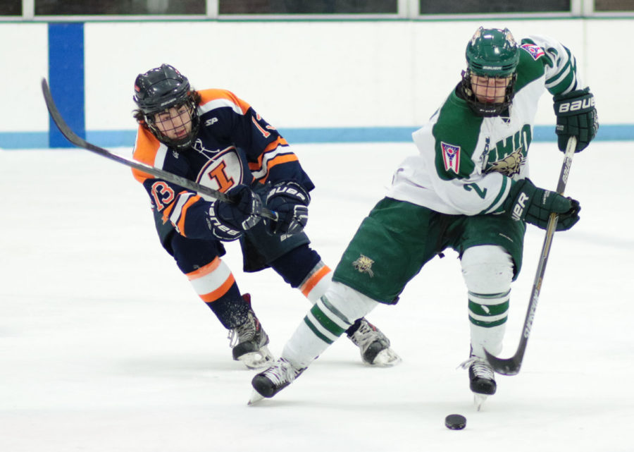 Illinois’ James Mcging attempts to steal the puck from Ohio’s Tyler Pecka during the CSCHL semifinals against Ohio at the Ice Arena on Saturday. Illinois lost 5-3 despite taking a 2-0 lead in the first period.
