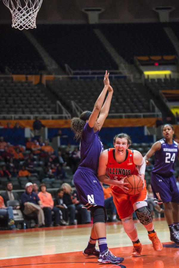 Illinois Chatrice White (32) tries to edge past her opponent during the game versus Northwestern at the State Farm Center on Thursday, January 22, 2015.