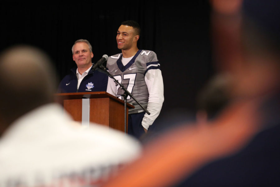 Illinois football head coach Tim Beckman watches on as Dre Brown, a recruit from DeKalb, IL addresses the audience during the 2015 Signing Day event held at the Colonnades Club on Wednesday, Feb. 4, 2015.