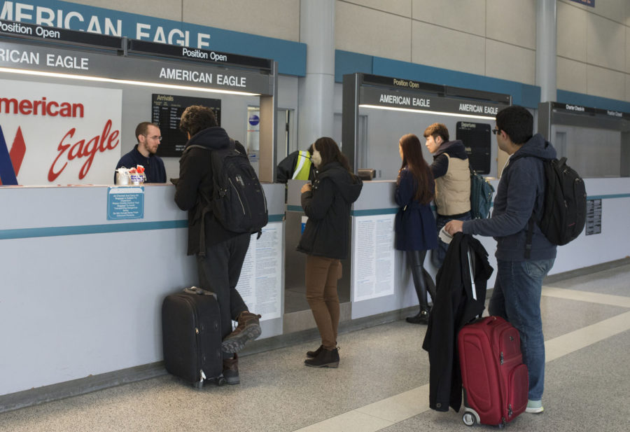 Travelers check in at Willard Airport. The University hopes to work with the community to make the airport more convenient for University students.