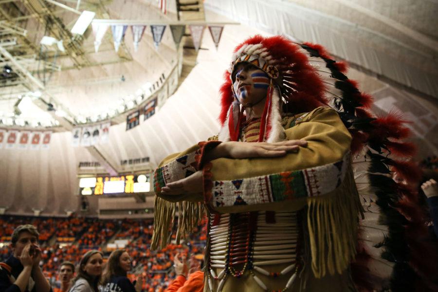 Ivan+Dozier%2C+a+graduate+student%2C+dressed+as+%E2%80%9CChief+Illiniwek%E2%80%9D+walks+around+the+stadium+during+the+game+against+Northwestern+on+Saturday.+Many+Unofficial+shirts+use+versions+of+the+Chief+logo+and+can+sometimes+have+questionable+meanings.