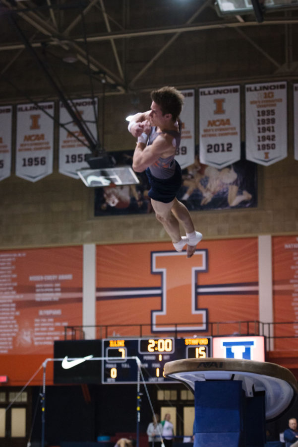 Illinois Bobby Baker launches off the vault during the meet against Stanford at Huff Hall on Friday, March 6. The Illini lost 21-9.