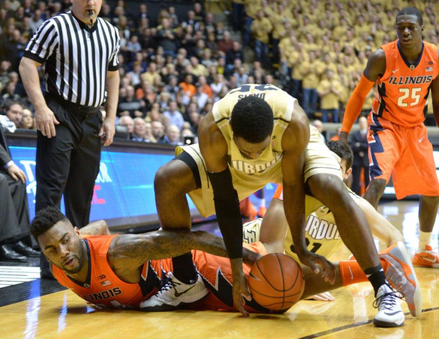 Illinois' Rayvonte Rice (24) and Purdue's Raphael Davis (35) fight for a loose ball during the game at Mackey Arena in West Lafayette, Indiana on Saturday, March 7, 2015. The Illini lost 63-58.
