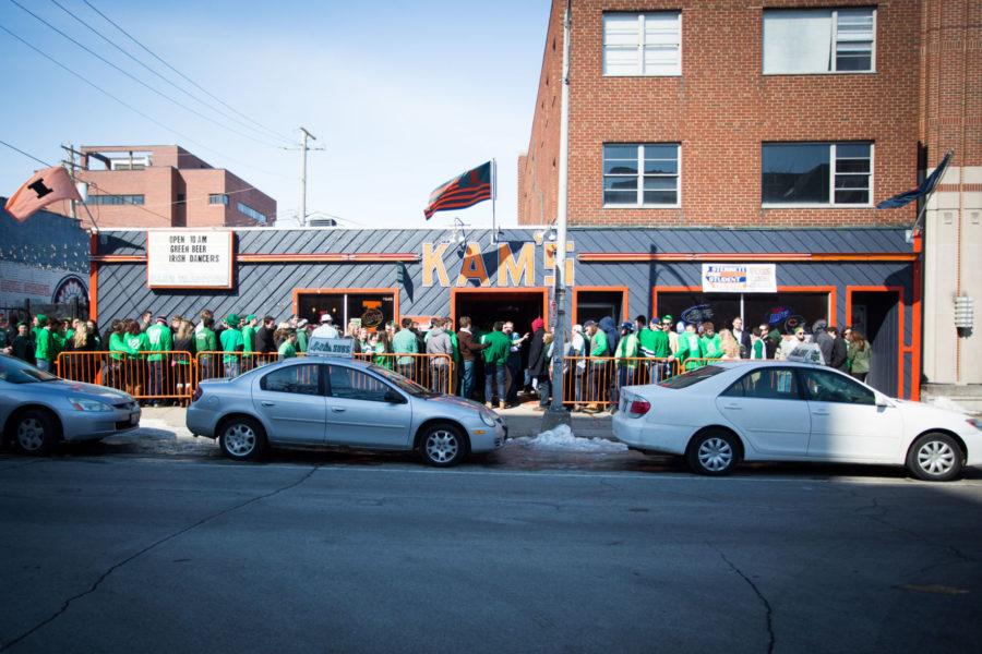 People crowd outside KAMS on the afternoon of Unofficial. Festivities start as early as 6 a.m. for some, who celebrate with a day of drinking at campus bars and parties.