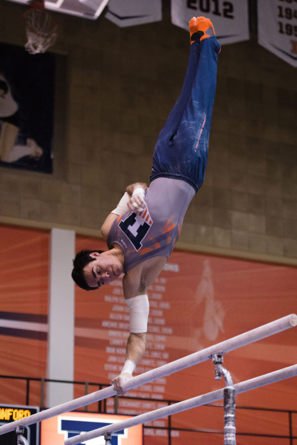 Illinois Jordan Valdez performs a routine on the parallel bars during the meet against Stanford at Huff Hall on Friday, March 6.The Illini lost 21-9.