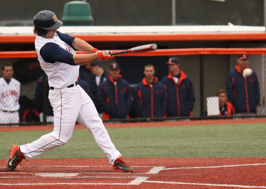 Illinois David Kerian (12) hits the ball during the game against Lindenwood University at Illinois Field, on March 18. The Illini won 7-1.