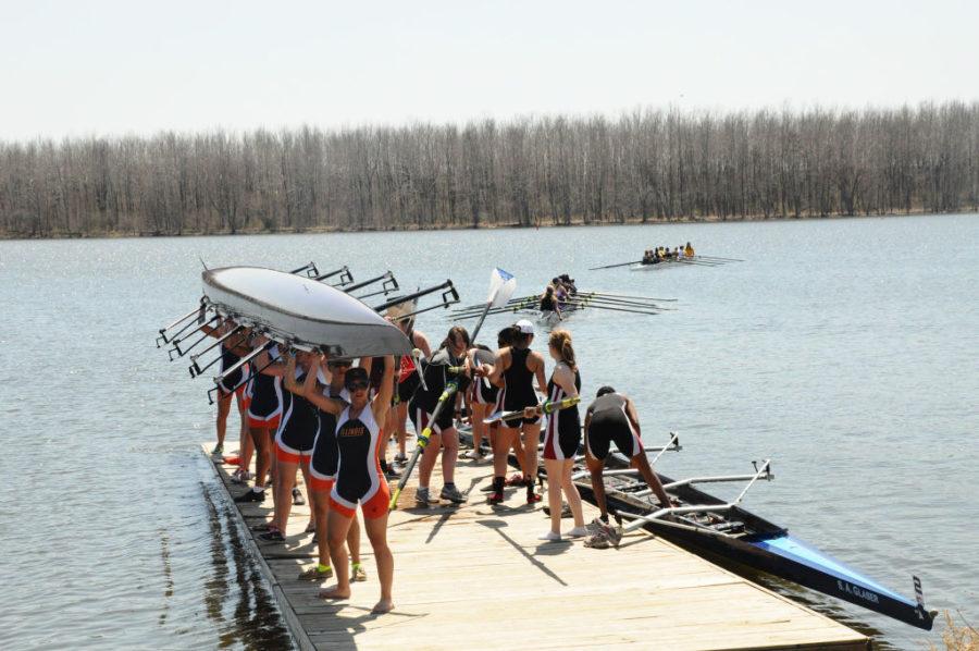 Women’s Varsity 8+ (UChicago Varsity 8+ on dock as well), Illinois Collegiate Rowing Invitational in Clinton Lake, DeWitt, Illinois in April 2014.