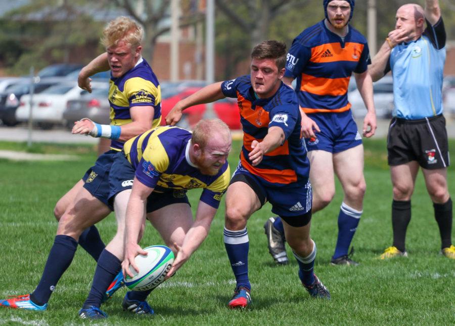 Illinois Joe Bird goes after Michigans offense during the Big Ten Rugby Tournament v. Michigan at the Complex Fields on Saturday.