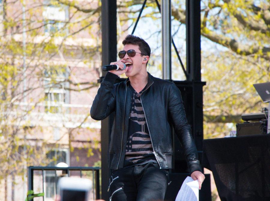 Timeless lead singer, Cal Shapiro, freestyle raps a song about the University during Spring Jam at the Main Quad on Sunday.