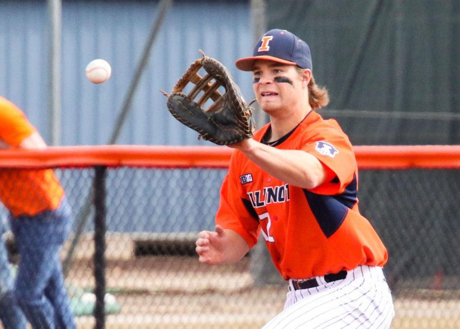 Illinois David Kerian (12) attempts to catch a ball at first base during the baseball game v. SIU at Illinois Field on Saturday, March 14. Illinois won 6-2.