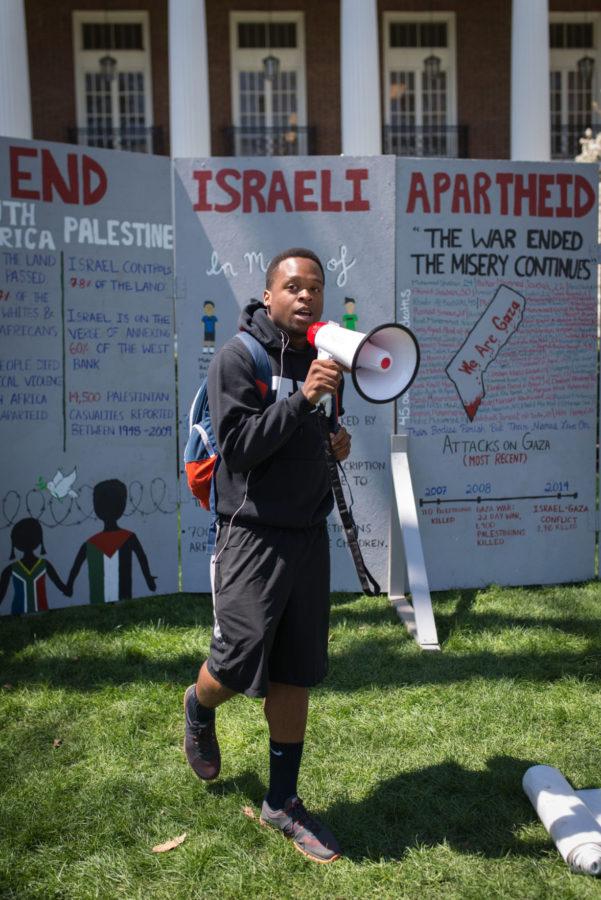 Zaid Hameed, junior in LAS, speaks about Israeli Apartheid in front of the English building at the Main Quad Tuesday.