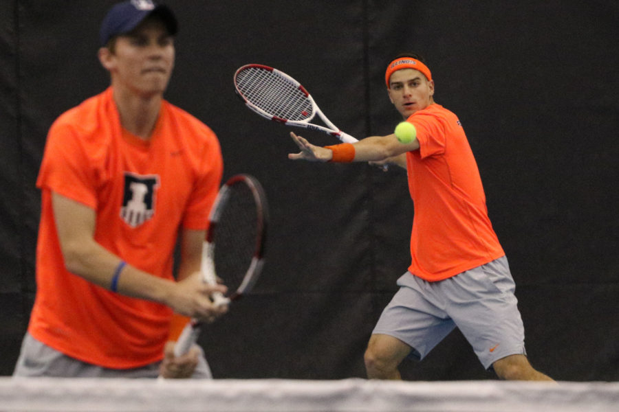 Illinois’ Aron Hiltzik attempts a return during the tennis game vs. Ohio State at Atkins Tennis Center on March 29. Illinois looks to continue flawless play this weekend.