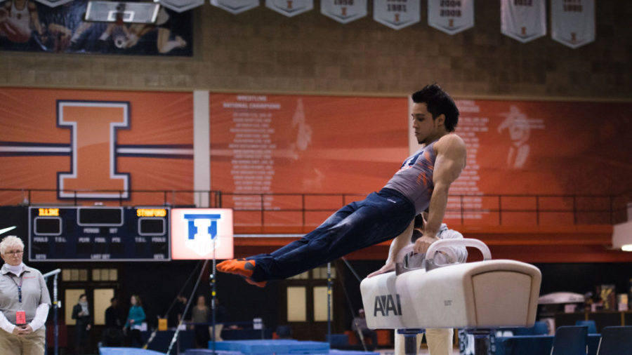 Illinois’ C.J. Maestas performs a routine on the pommel horse during the meet against Stanford at Huff Hall on March 6.The Illini lost 21-9.