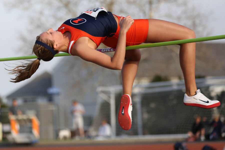 Illinois Kandie Bloch-Jones hits the bar in the high jump event during the Illinois Twilight Track and Field meet at Illinois Soccer and Track Stadium, on Saturday, April 12, 2014.