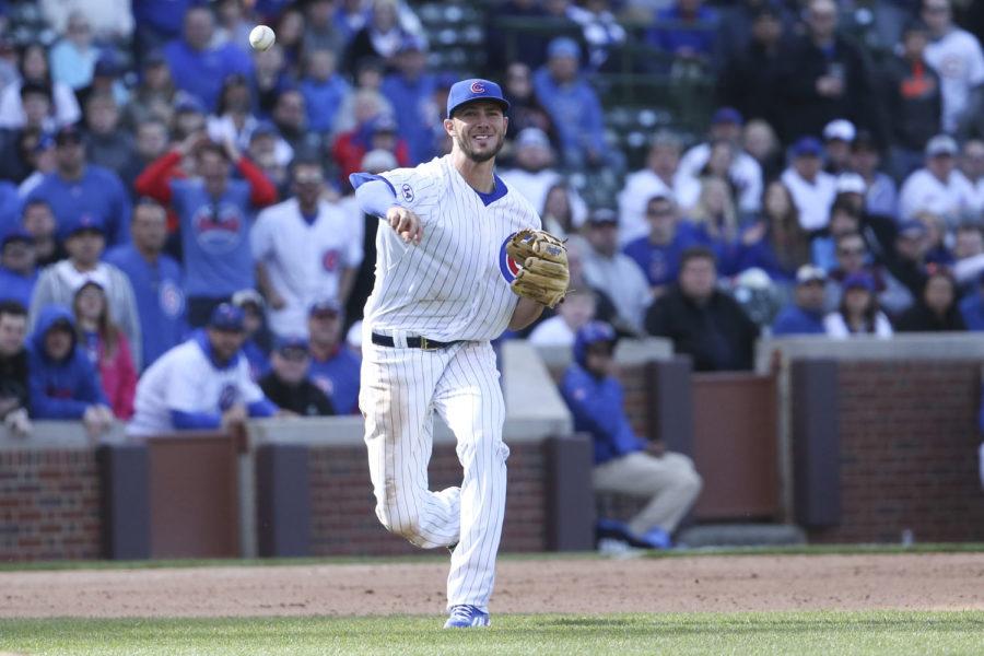 Chicago Cubs third baseman Kris Bryant throws the ball to first base during the 10th inning against the San Diego Padres at Wrigley Field in Chicago on April 18. The Cubs won, 7-6, in 11 innings.