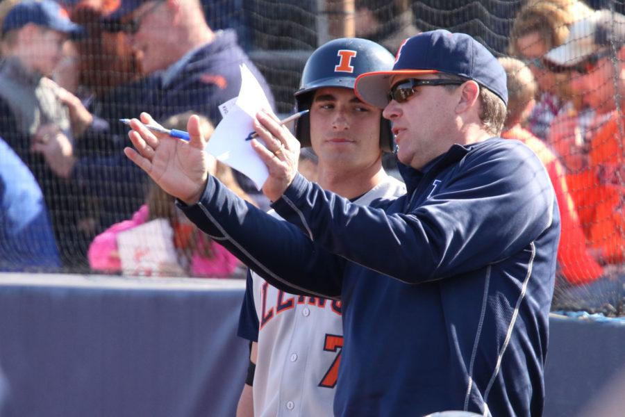 Illinois’ head coach Dan Hartleb gives Reid Roper some guidance during the baseball game against Northwestern at Illinois Field on Saturday.