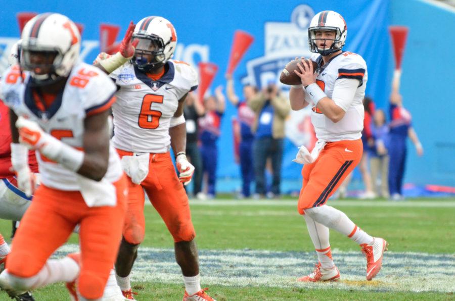 Illinois Wes Lunt (12) looks to pass the ball during the Zaxbys Heart of Dallas Bowl against Louisiana Tech at Cotton Bowl Stadium in Dallas, Texas on Dec. 26, 2014. The Illini lost 35-18.