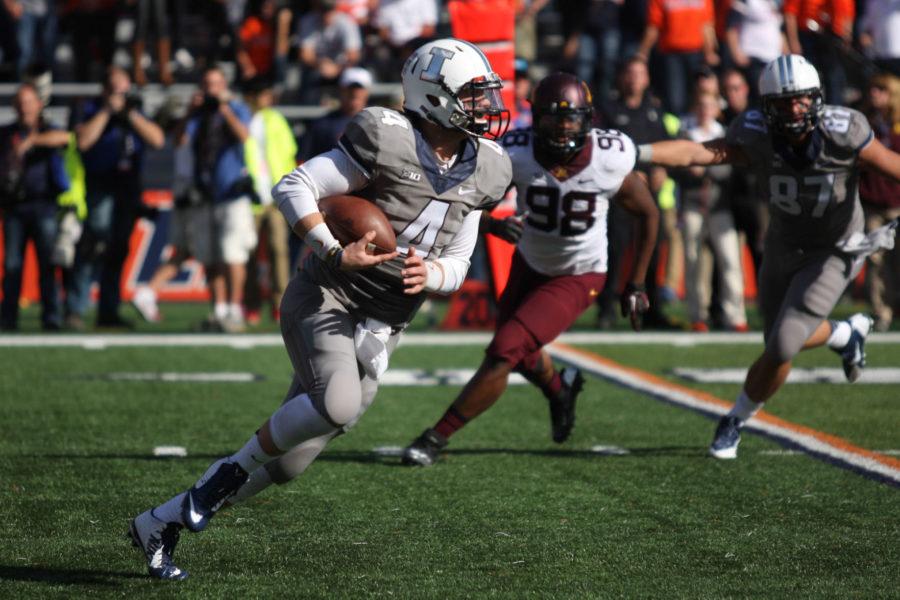 Illinois Reilly OToole (4) carries the ball during the homecoming game against Minnesota at Memorial Stadium on Saturday, Oct. 25, 2014. The Illini won 28-24.