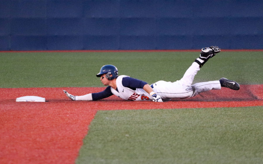 Illinois Casey Fletcher (3) slides for second base during the baseball game vs. Indiana at Illinois Field on Friday, April 17. Illinois won 5-1.