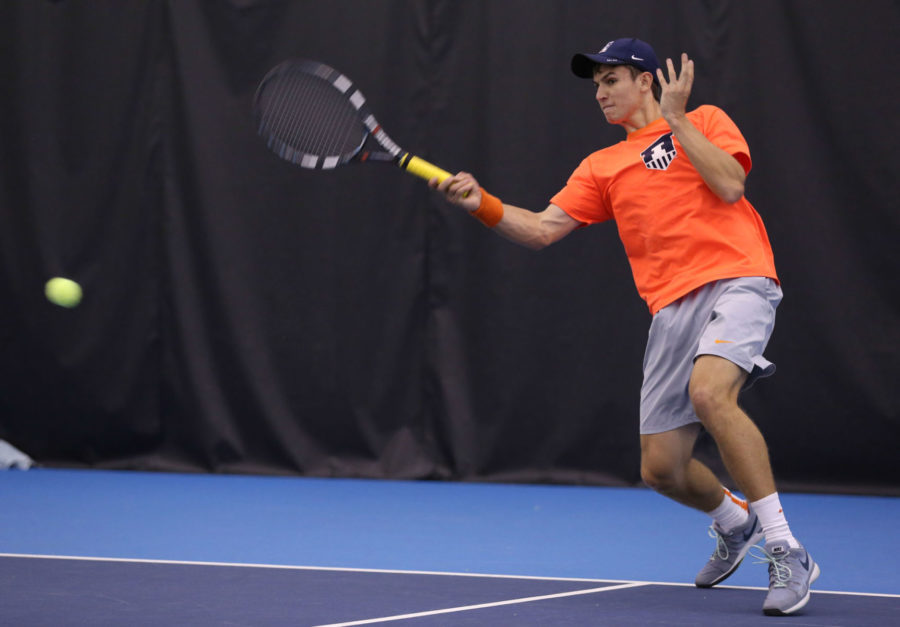 Illinois Aleks Vukic attempts to return the ball during the match against Ohio State at Atkins Tennis Center, on Sunday, March 29. 