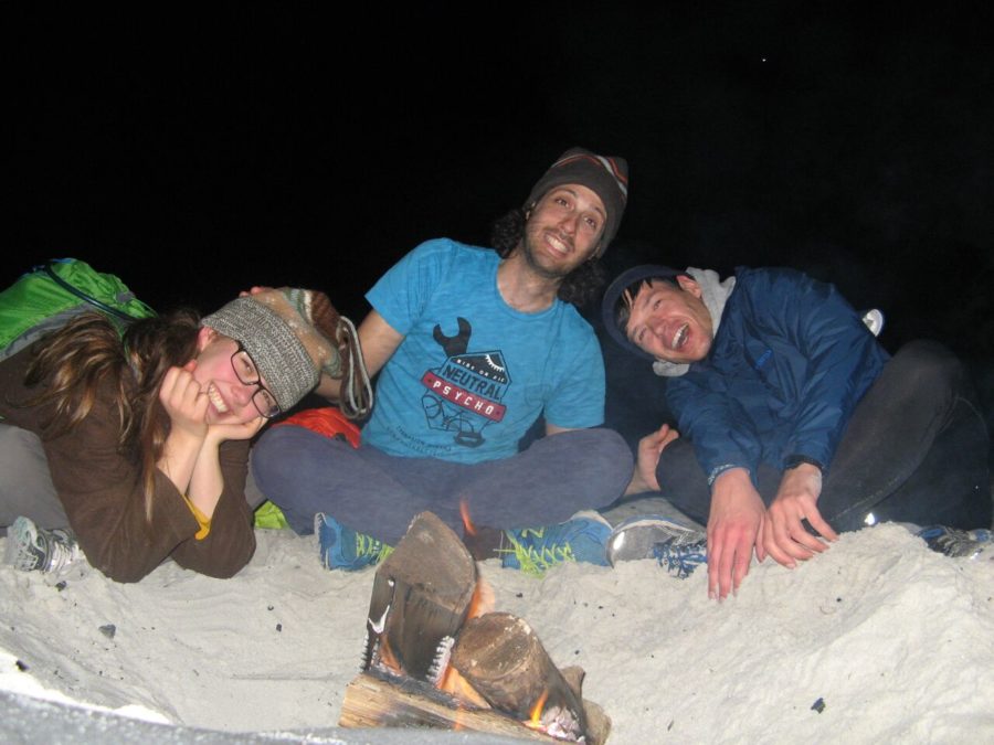 Kamilla Kinard, Guy Tal and Ryne Leuzinger at a beach fire on the second day of their bike expedition on Dec. 28, 2014, in Carmel, California.