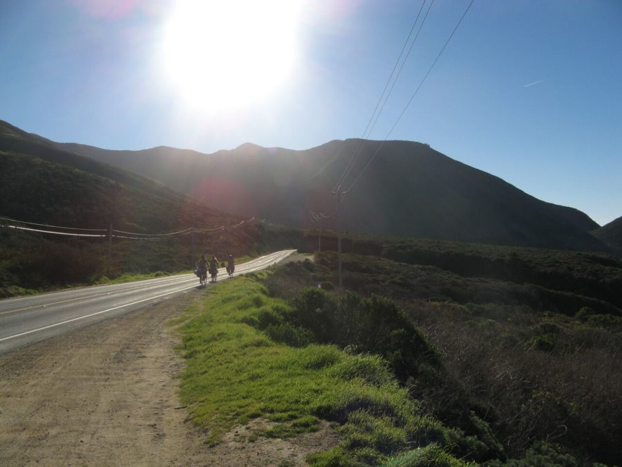 From back to front, Nora Tien, Kamilla Kinard and Ryne Leuzinger biking up Big Sur, California, on the third day of their bike expedition on Dec. 29, 2014.