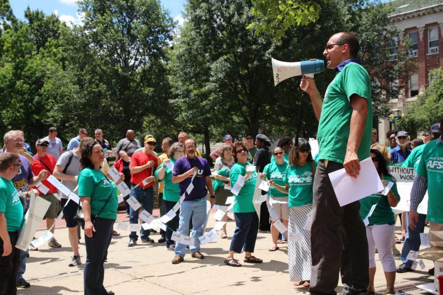 Dave Beck, staff representative for AFSCME Council 31, chants to union members to prepare to walk over to President Killeens office. Collectively, the union members are holding over 650 postcards, asking for fair contracts and respect from the University.