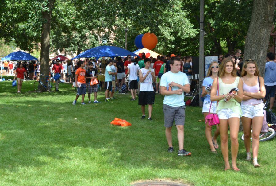 Students make their way through campus activity booths during Quad Day last year.