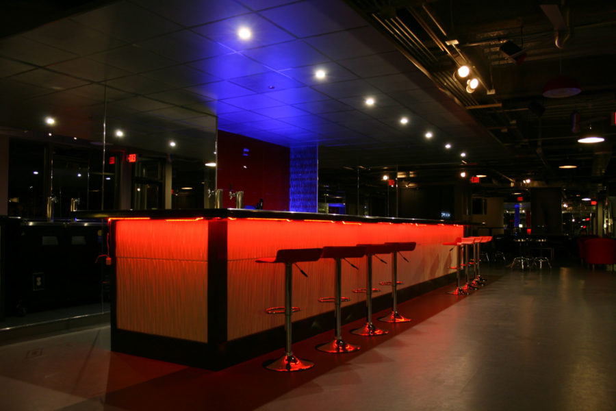  The bar at Venue 51, which is colored by an array of lights, is now opening to the public for Wednesday night drink specials. Previously, the bar was known for hosting private parties.