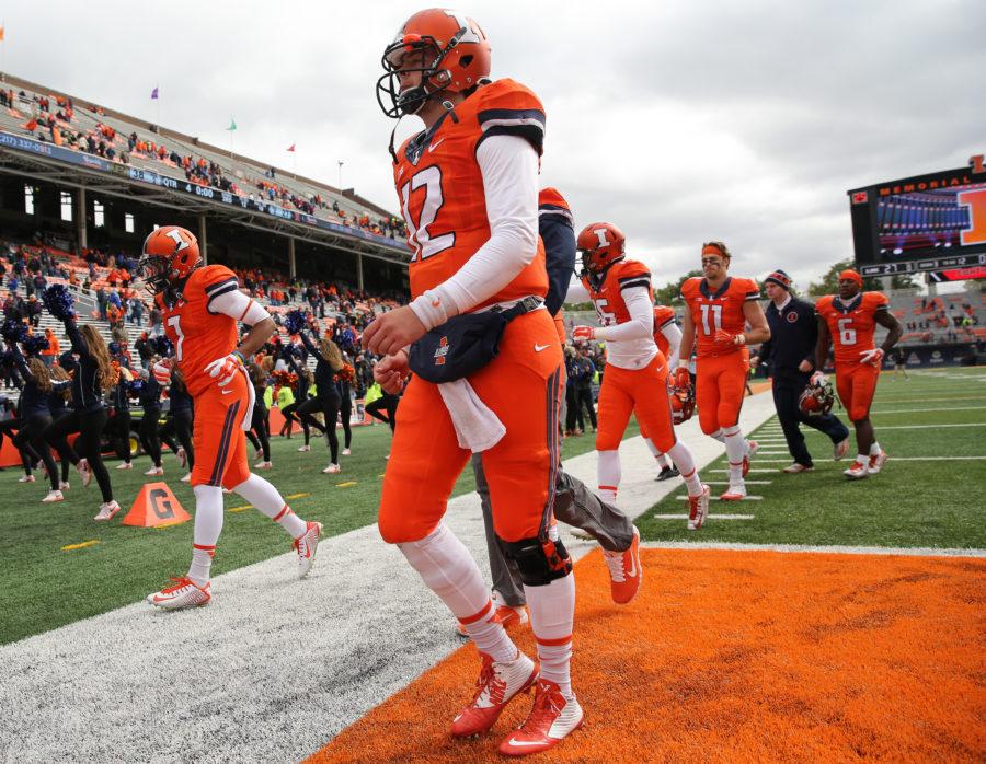 Illinois  Wes Lunt (12) walks towards the locker after the game against Purdue at Memorial Stadium on Saturday Oct. 4, 2014. The Illini lost 38-27.