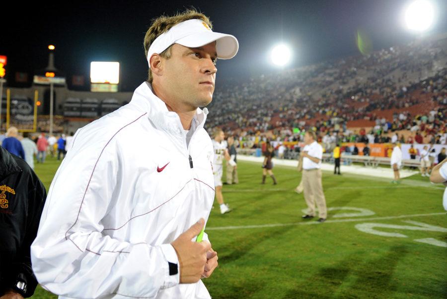 USC head coach Lane Kiffin jogs off the field after losing, 62-51, to Oregon at the Los Angeles Coliseum on Saturday, November 3, 2012, in Los Angeles, California.