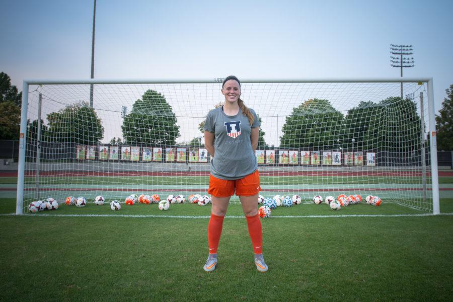 Jannelle Flaws stands with 50 balls representing the record-setting 50 goals she has scored over her Illinois career.