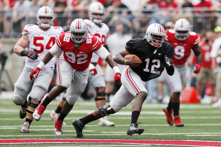 Ohio State quarterback Cardale Jones (12) runs the ball in the first half of the Buckeyes&apos; Spring Football Game on Saturday, April 18, 2015, in Columbus, Ohio. (Courtney Hergesheimer/Columbus Dispatch/TNS) 