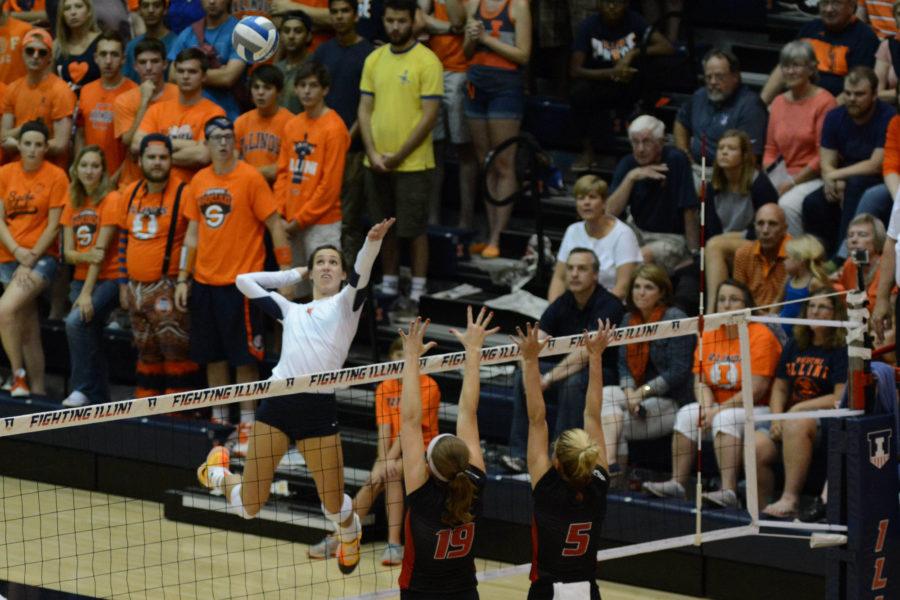 Illinois Michelle Strizak (4) attempts to spike the ball during the game versus Louisville at Huff Hall on Friday, August 28, 2015.The Illini won 3-0.
