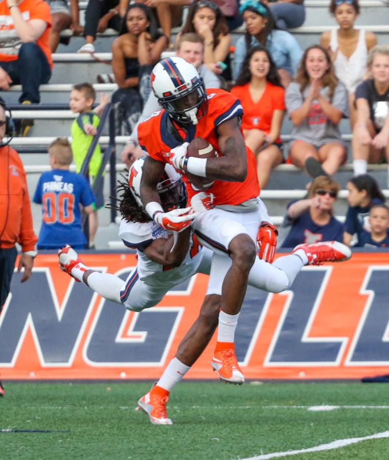 Illinois Geronimo Allison (8) attempts to shake off Jaylen Dunlap (28) during the annual football Spring Game at Memorial Stadium on Saturday, Apr. 18, 2015. The Orange won 44-41.