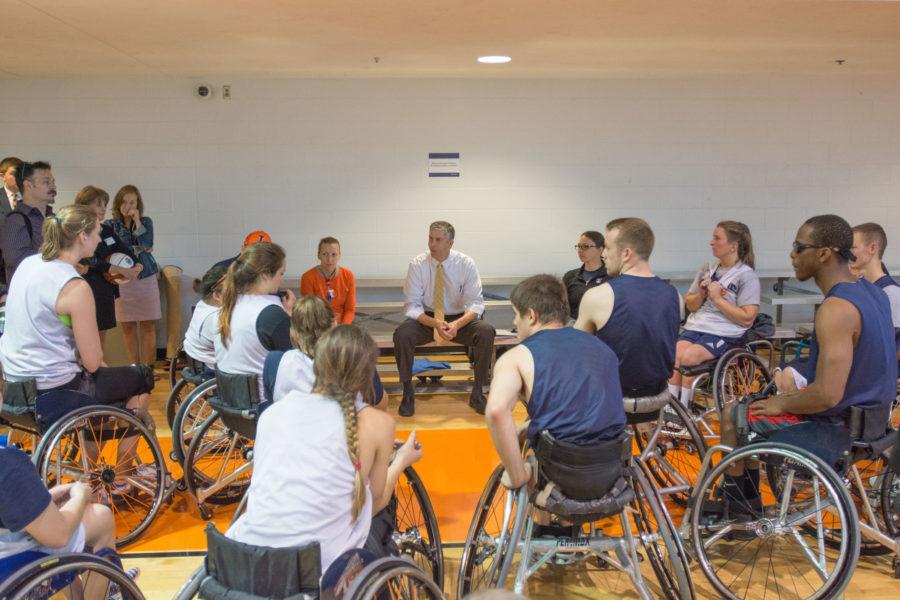 U.S. Secretary of Education Arne Duncan talks with members of the Universitys wheelchair basketball team Wednesday morning at the ARC.