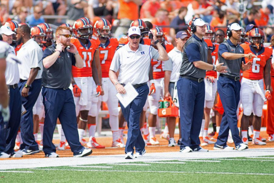 Illinois head football coach Bill Cubit gets fired up on the sideline during the game against Kent State at Memorial Field on Saturday, Sept. 5. Illinois won 52-3.
