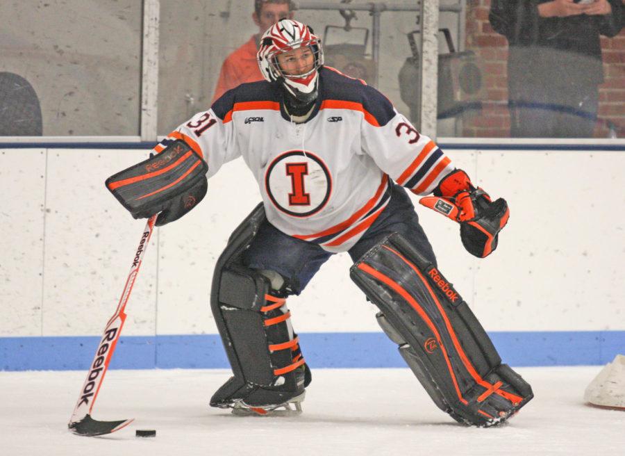 Illinois Joe Olen (31) looks for somebody to pass the puck to during the Ohio hockey game at the Ice Arena on Friday, October 24, 2014. The Illini won 2-1.