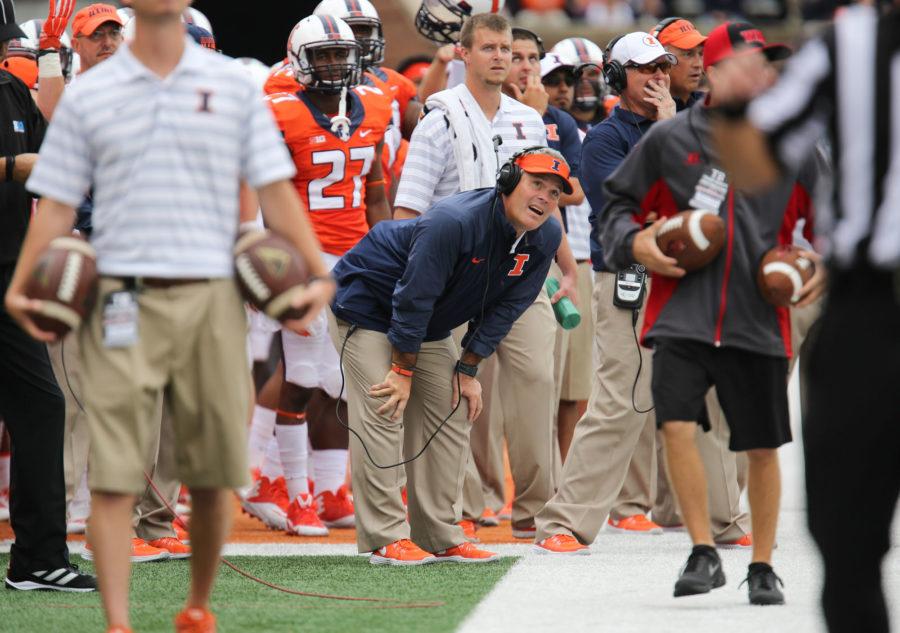 Illinois head coach Tim Beckmam reacts after having a referee decision go against Illinois during the game against Western Kentucky at Memorial Stadium on Saturday, Sept. 6, 2014. The Illini won 42-34.