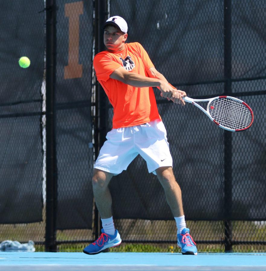 Illinois Aron Hiltzik attempts to return the ball during the Big Ten Mens Tennis Tournament final against Ohio State at the Khan Outdoor Tennis Complex, on Sunday, April 26, 2015. The Illini won 4-0.
